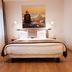Rumours Inn Istanbul guest room with double bed, bedside lamps and wall art