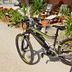 Flairhotel am Wörthersee in Velden am Wörthersee: mountain bike on sunny terrace with lounge chairs