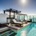 Nirvana By The Sea in Coolangatta rooftop pool with sun loungers and ocean views