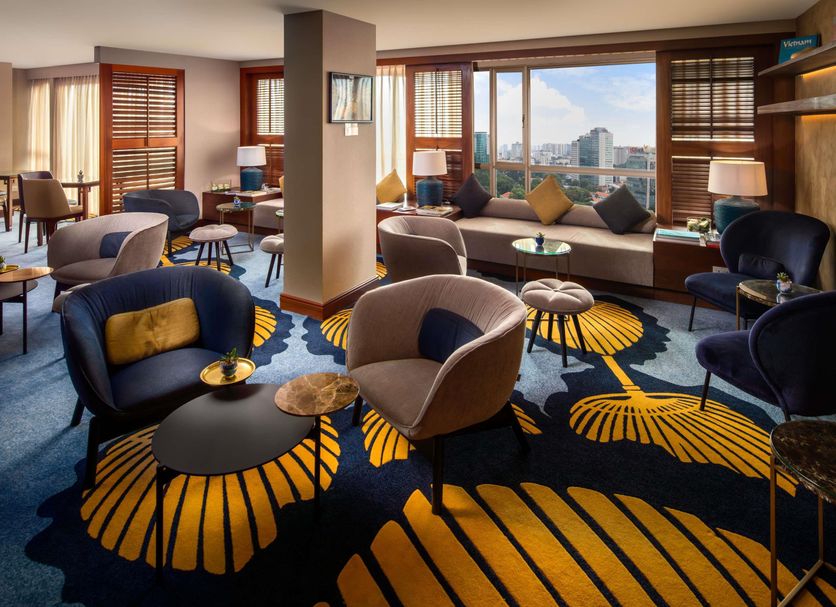 Sofitel Saigon Plaza lounge with city views, large windows, and modern seating in Ho Chi Minh City
