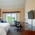 Four Points by Sheraton Buffalo Grove guest room with king bed, desk and window view