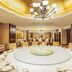 Beijing Xinjiang Plaza in Beijing banquet hall with large round dining table and chandeliers