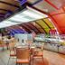 Hotel Combermere in Shimla restaurant with glass display counter and seating under a colorful arched ceiling