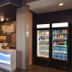 Holiday Inn Express & Suites Oklahoma City Mid-Arpt Area lobby check-in desk and guest market coolers