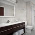 Home2 Suites by Hilton Lake City bathroom with vanity, toilet, and tub-shower combo