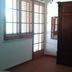 Casa Siciliana Altarbiah in Trabia: simple room with wooden wardrobe and shuttered window