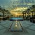 Omni Amelia Island Resort & Spa in Fernandina Beach, sunset view over palm-framed pool and water feature