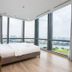 Homes by Christine - Vinhomes Central Park bedroom with floor-to-ceiling city and river views, Ho Chi Minh City