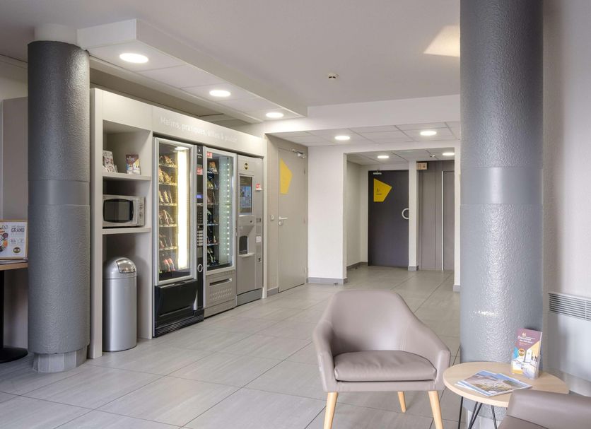 B&B HOTEL Calais Centre St Pierre lobby with vending machines and seating in Calais