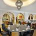 Hilton Suites Jabal Omar Makkah dining room in Mecca with ornate arches and round tables