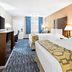 Baymont by Wyndham Port Arthur/Groves Area guest room with two beds and TV in Port Arthur