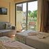 Rosy Suites Hotel in Kusadasi room with sofa, twin beds, and balcony view