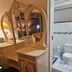 The Royal Princess Garden - Randburg bathroom vanity with ornate mirrored dresser and adjoining toilet area