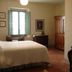 Agriturismo La Capitata room in Pian di Scò with bed, window, armoire and desk