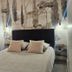 Le Clos Loret in Saint-Germain-du-Corbéis, cozy bedroom with a neatly made bed and patterned wall art