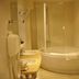 Hotel Aranda bathroom with sink, shower-bathtub, and wall heater in Aranda de Duero