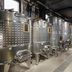 The Winery Hotel, Solna wine cellar with stainless steel fermentation tanks and pipes