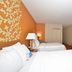Fairfield Inn and Suites by Marriott Williamsport room with two beds, dresser, TV and mini fridge