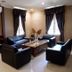 Sanghyang Indah Spa resort in Anyar lounge with black leather seating and wooden coffee table
