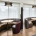 Courtyard by Marriott Chicago Waukegan/Gurnee lounge with booth seating and round tables in Waukegan