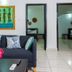 Sarges Hotel in Serrekunda lobby lounge with sectional sofa, coffee table, wall art and open doorways