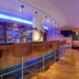 Novotel Freiburg am Konzerthaus bar lounge with high stools and warm seating in Freiburg im Breisgau
