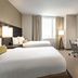 Residence Inn By Marriott New York Jfk Airport in Queens guest room with two beds, desk and TV
