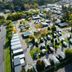 Aerial view of NRMA Ballarat Holiday Park in Ballarat with cabins, caravans, and tree-lined grounds
