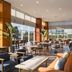 Crowne Plaza Istanbul - West by IHG restaurant with large windows, tables and lounge seating in Istanbul