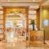 The Royal City Hotel Bangkok lobby entrance to Garden Cafe with warm wood accents and seating