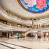 Dongguan Huaxi International Hotel lobby in Dongguan with grand staircase and floral ceiling mural