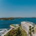 D-Resort Sibenik in Šibenik with a curved waterfront building and marina overlooking the bay