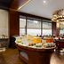Ramada Encore by Wyndham Jalandhar restaurant buffet with dining tables and chandeliers
