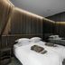 Mana Sleep & Spa in Druskininkai: modern bedroom with bed, mirrored wall, and soft LED lighting