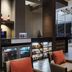 Hampton by Hilton Bogota Usaquen lobby with seating, bar counter, and glass walls in Bogotá