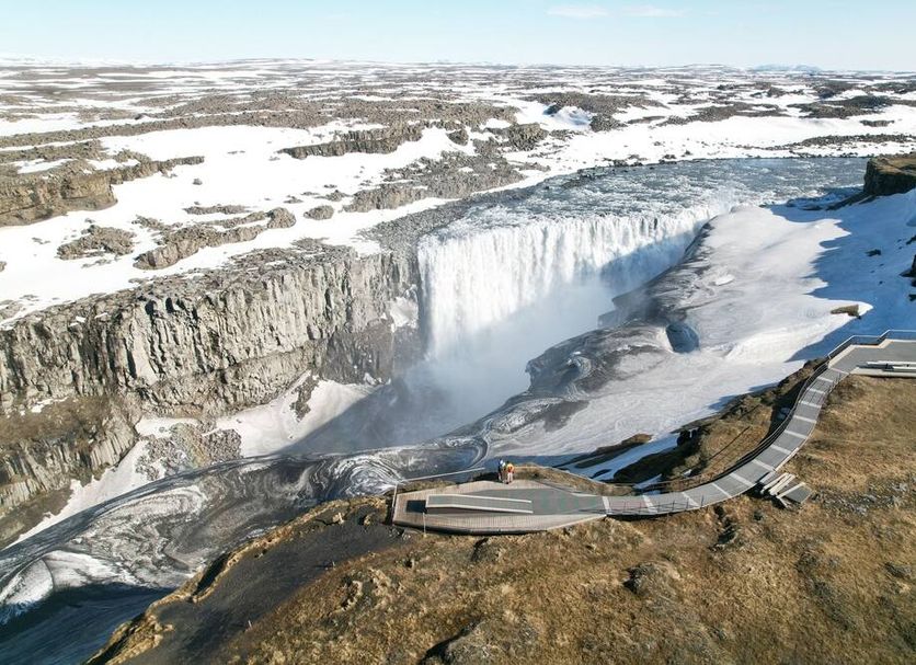 Guesthouse Brekka in Husavik with panoramic view of a frozen waterfall and snowy canyon