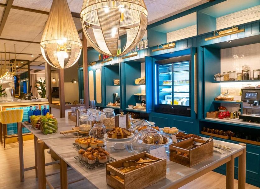 Breakfast buffet at Puente Colgante Boutique Hotel in Portugalete with pastries and hanging lights