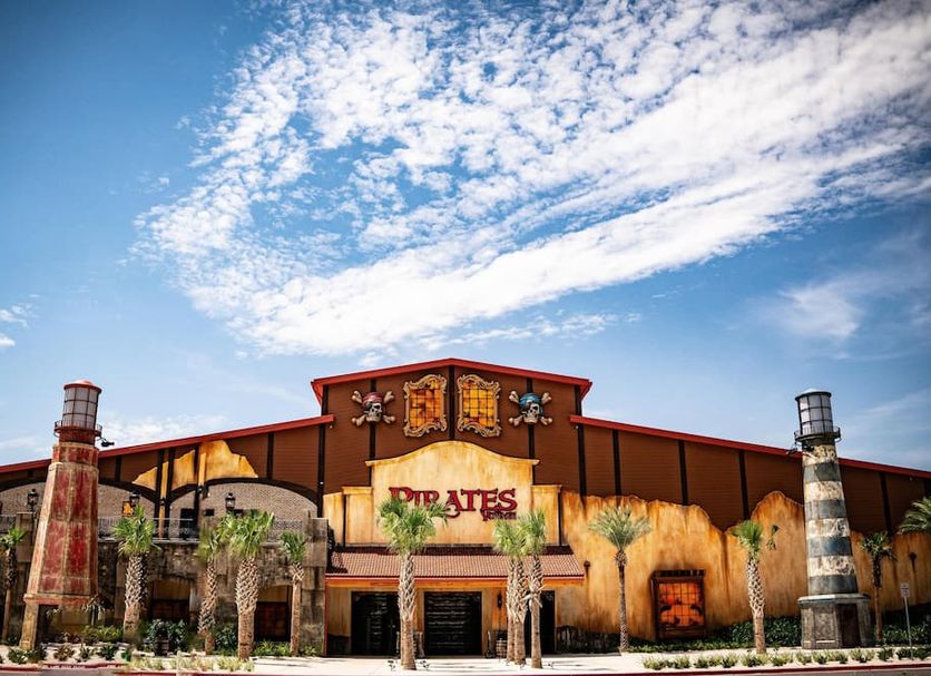 Pinnacle Port A-305 in Panama City Beach, exterior with pirate-themed facade and palm trees