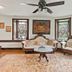Stone Manor Boutique Inn in Lovettsville: elegant sitting room with ornate sofa, chairs, table, and large windows