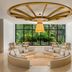 Waldorf Astoria Riviera Maya lobby lounge in Cancún with curved seating and garden-view windows
