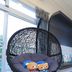 The House of Water in Dongshan Township, hanging egg chair by a window with plush toys