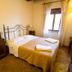Agriturismo Il Casale Degli Amici in Norcia: simple double bedroom with iron bed and window