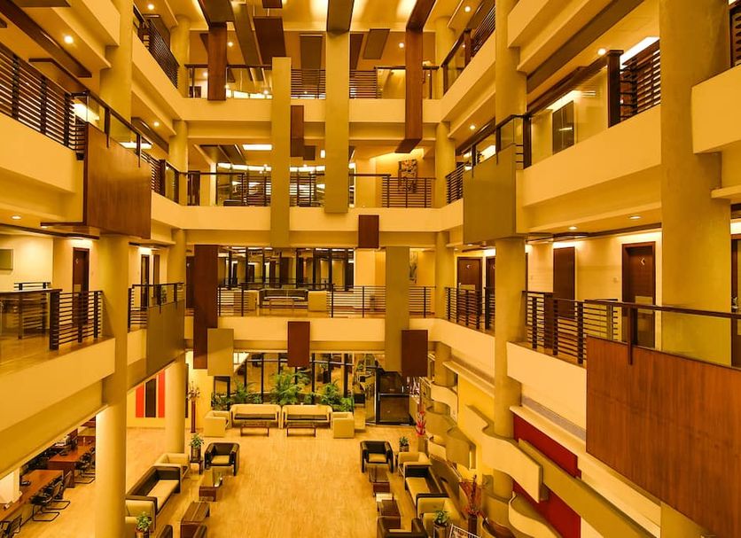 Interior atrium at Capitol Hill in Ranchi with multi-level balconies and lounge seating