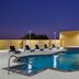 Fairfield Inn by Marriott Fort Stockton outdoor pool with lounge chairs and hot tub at dusk