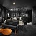 Petit Hôtel Confidentiel in Chambéry: stylish suite with desk, sofa, and glass-walled bedroom