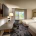 Fairfield Inn & Suites by Marriott Sierra Vista guest room with two beds, desk, chair and window