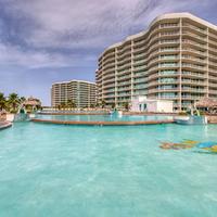 River-view condo with pool, waterslides, lazy river, putting green, & fishiing