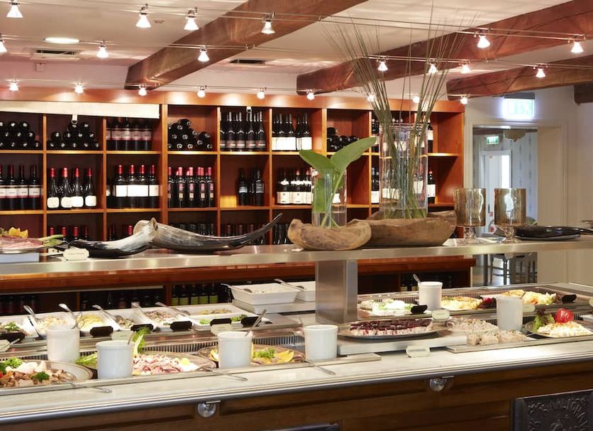 Margretetorps Gästgifvaregård in Ängelholm dining buffet with wine shelves and salad bar