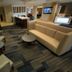 Holiday Inn Express & Suites West Coxsackie lobby seating area with sofa, chairs and front desk