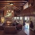 Cumberland Falls State Resort Park lobby with stone fireplace and rustic wood beams in Corbin